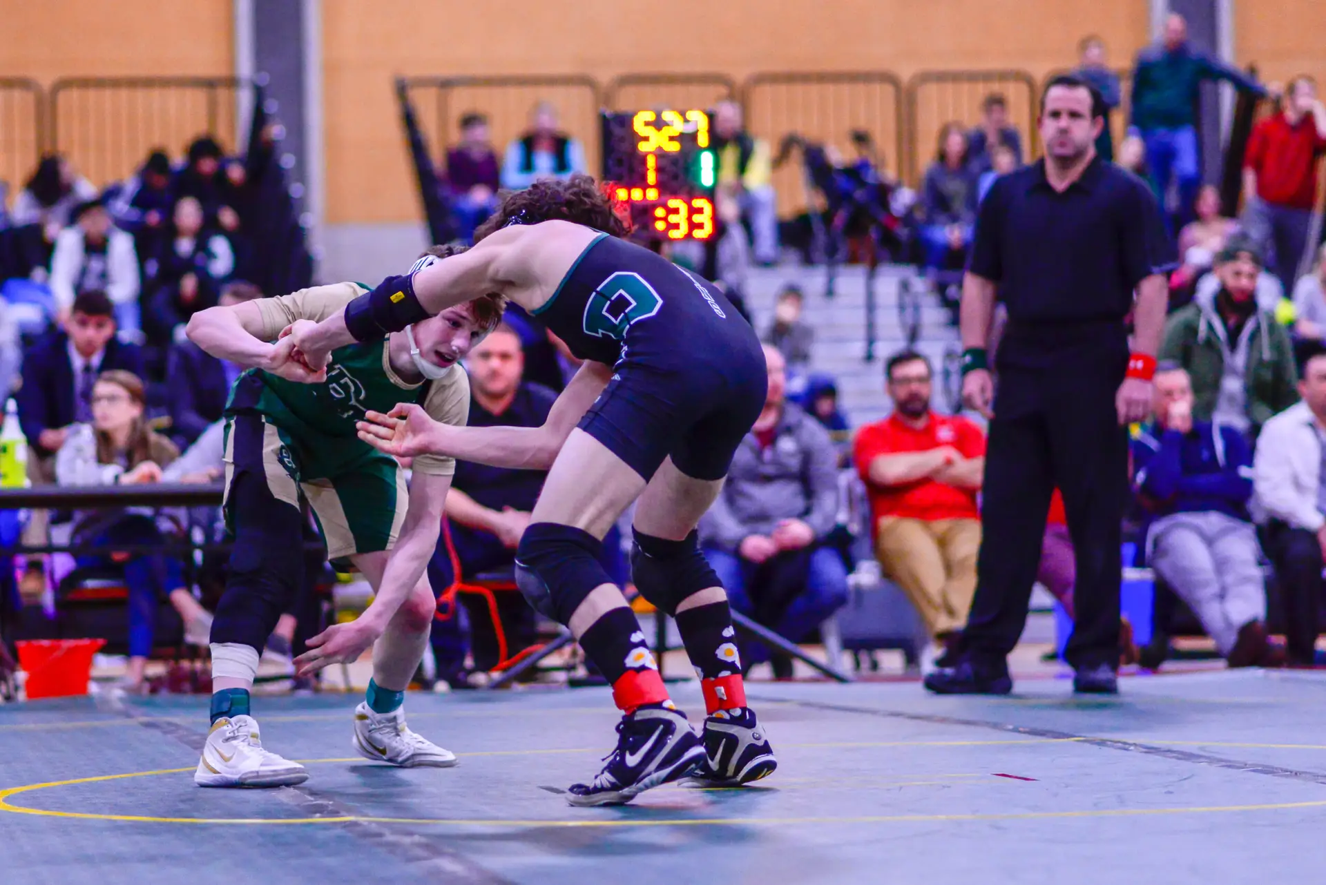 Andrew Fallon in the third period just prior to securing the winning takedown at the Rhode Island State Wrestling Championships to earn his third state title