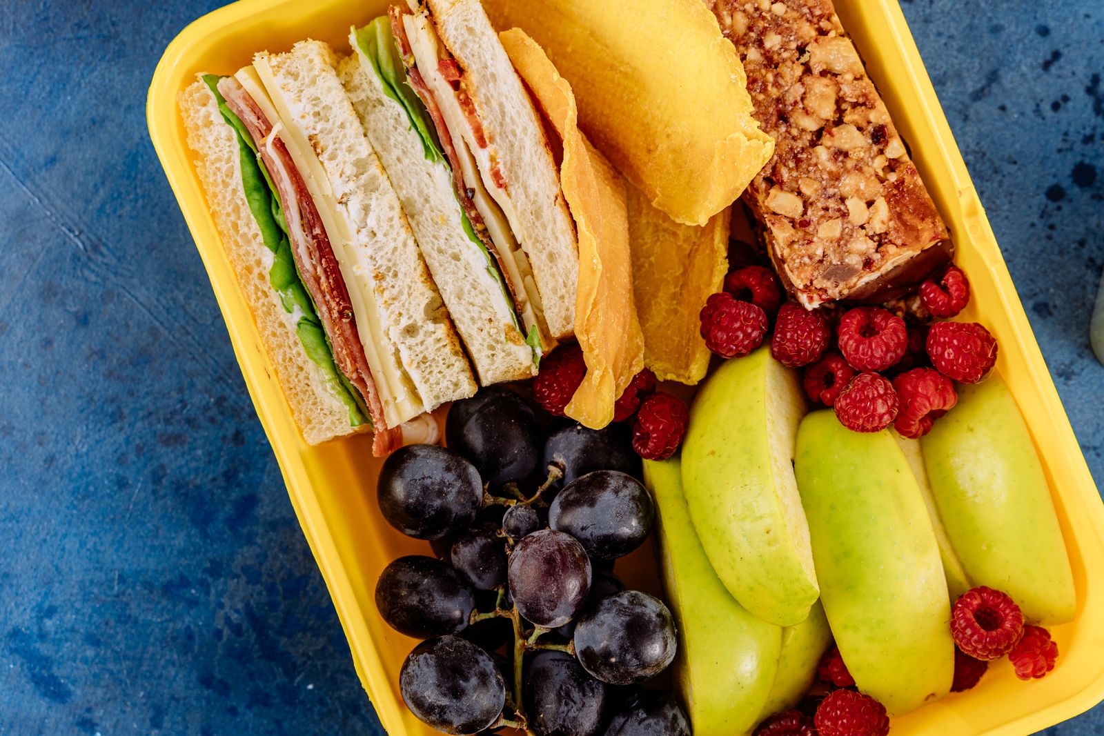 Packed cooler with sandwich fruit and snacks for a youth wrestling tournament