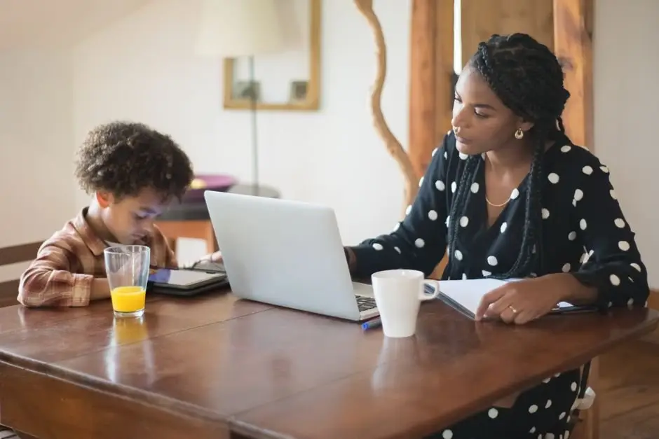 Parent registering their kid for a youth wrestling tournament online from the kitchen table